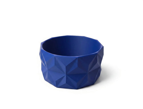 A blue and red geometric bowl with a faceted, low-poly design, shown on a clean white background.