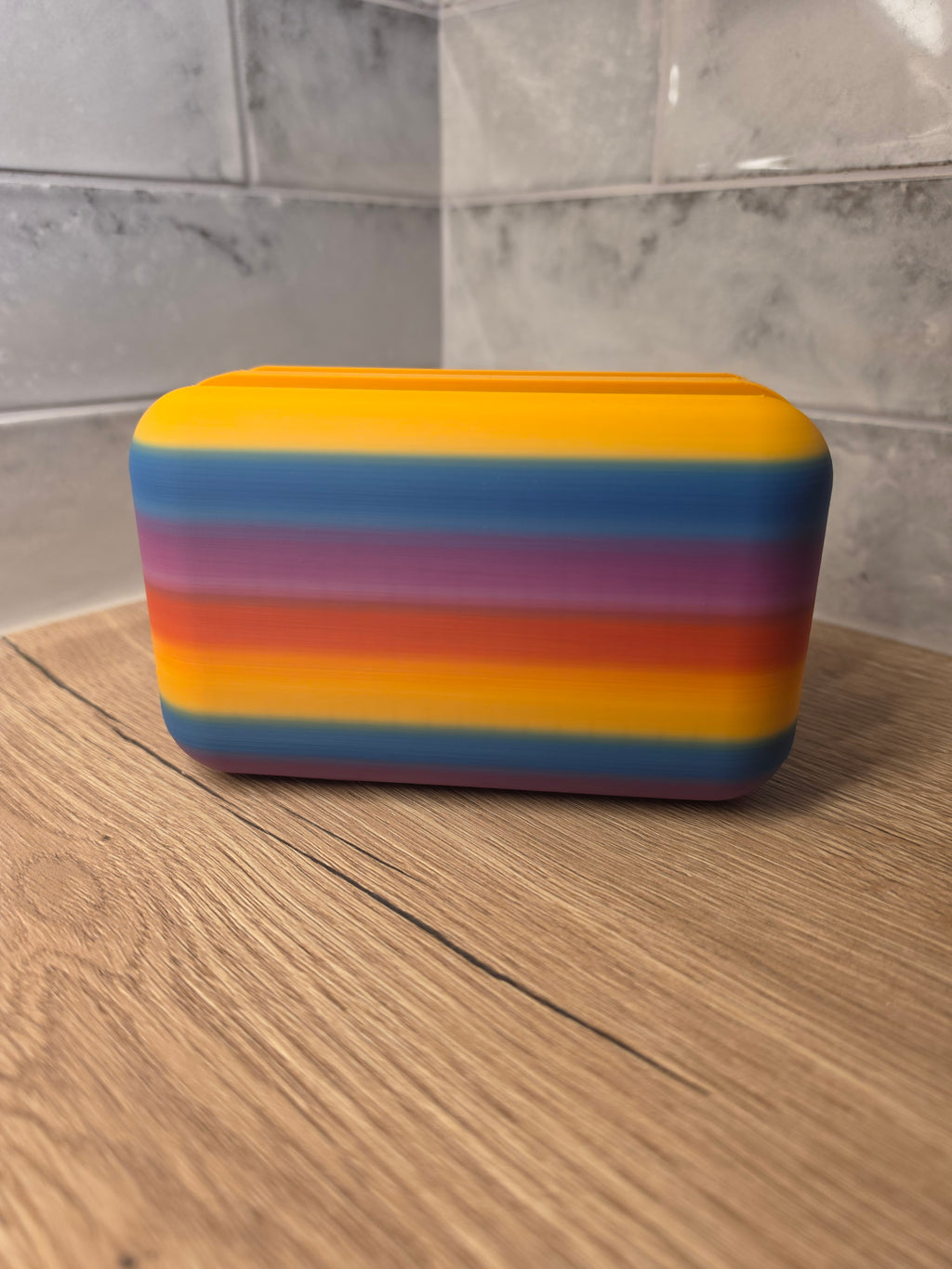 Colourful letter rack with 'POST' branding on the surface.