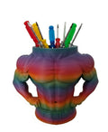 A novelty desk organizer shaped like a muscular male torso, featuring a rainbow gradient color scheme and filled with various colored screwdrivers, on a plain white background.