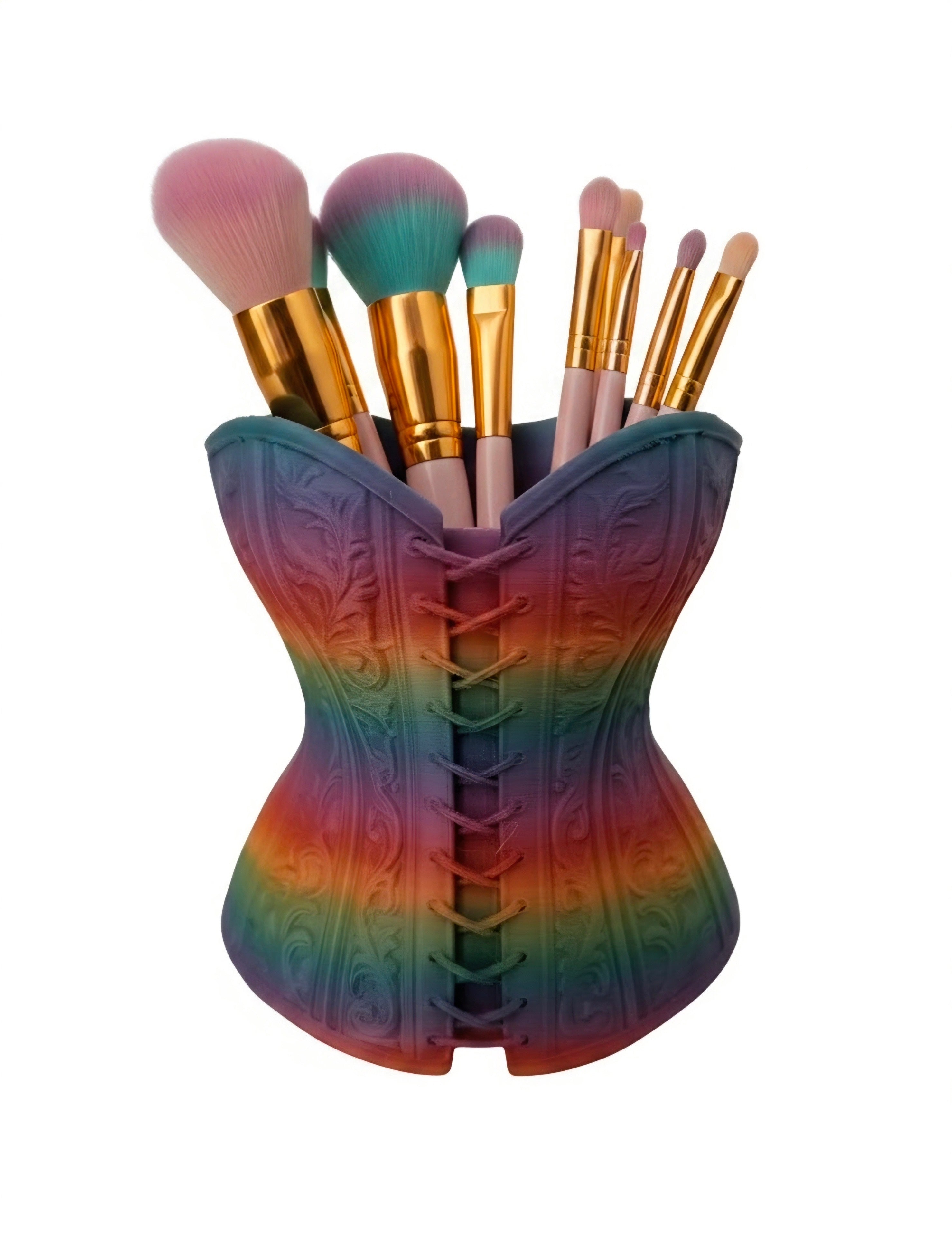 A makeup brush set, held in a decorative corset-shaped container with a rainbow gradient and embossed floral pattern, isolated on a white background.